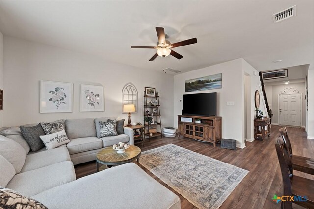 810 Mclaury Cv, Killeen, TX 76542 - living room featuring visible vents, baseboards, ceiling fan, and dark wood-style floors