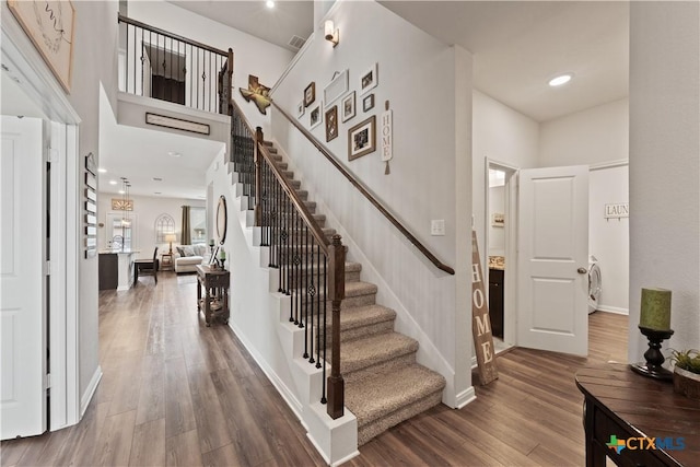 810 Mclaury Cv, Killeen, TX 76542 - stairway featuring recessed lighting, baseboards, visible vents, and wood finished floors