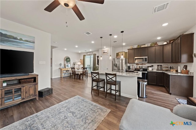 810 Mclaury Cv, Killeen, TX 76542 - living area with recessed lighting, ceiling fan, dark wood-style floors, and visible vents