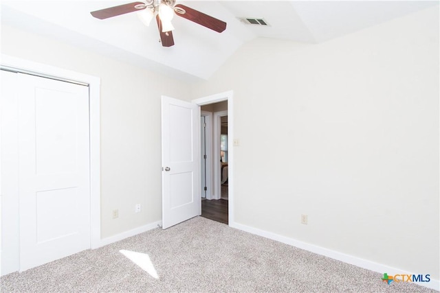 1418 Cedar Ln, Temple, TX 76502 - unfurnished bedroom with carpet flooring, vaulted ceiling, baseboards, ceiling fan, and a closet