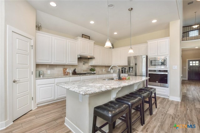 kitchen featuring appliances with stainless steel finishes and white cabinetry