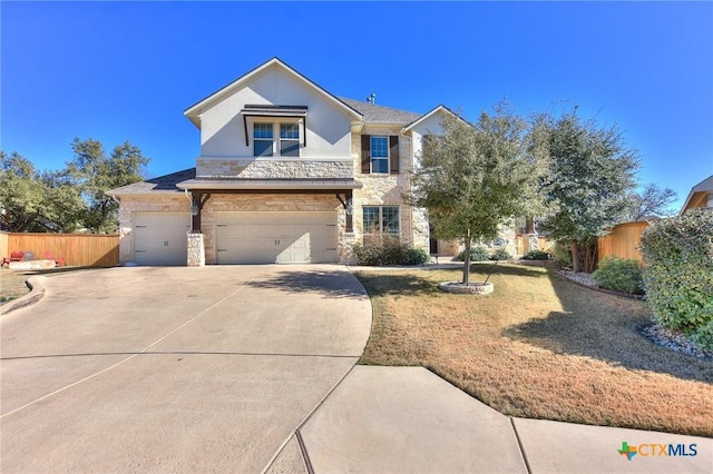 view of front of house with a garage and a front yard