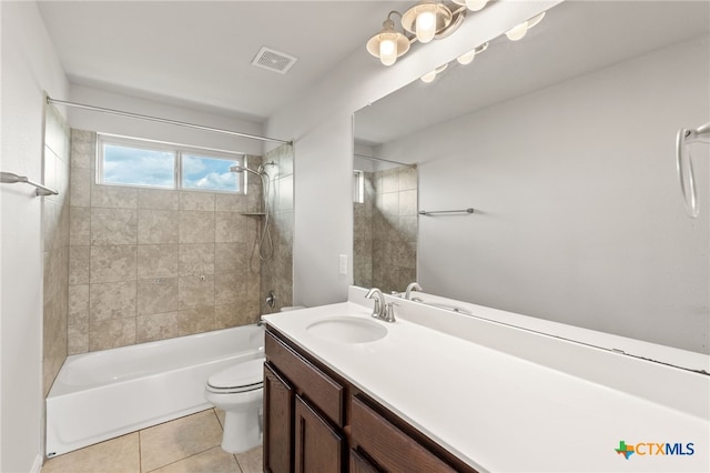 1904 Garretts Way, Manchaca, TX 78652 - full bathroom with tile patterned flooring, visible vents, toilet, vanity, and  shower combination