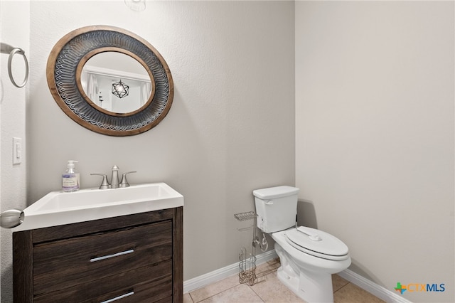 1904 Garretts Way, Manchaca, TX 78652 - half bath featuring tile patterned floors, baseboards, vanity, and toilet