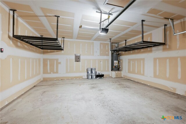 1904 Garretts Way, Manchaca, TX 78652 - garage with water heater, electric panel, and a garage door opener