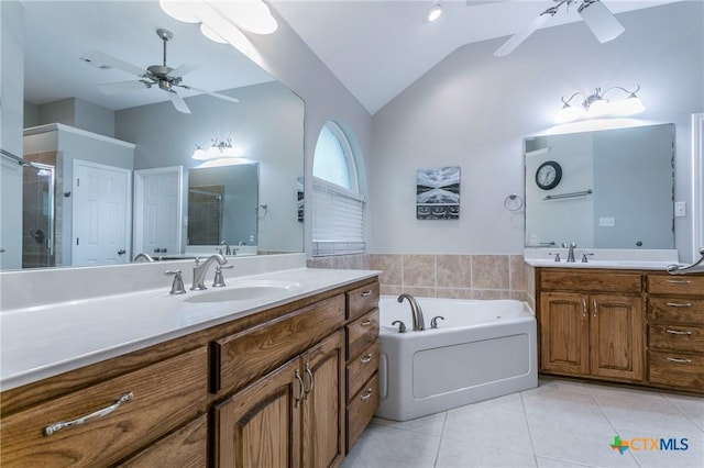 bathroom with ceiling fan, a shower stall, vaulted ceiling, a sink, and tile patterned floors