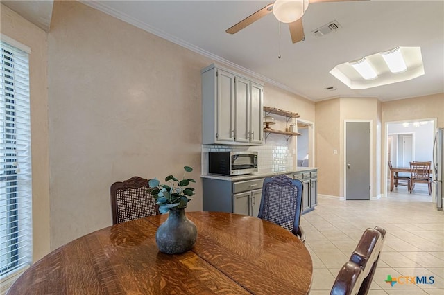 806 Northstar Loop, New Braunfels, TX 78130 - dining area featuring light tile patterned flooring, a ceiling fan, crown molding, and baseboards