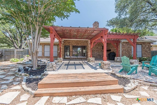 806 Northstar Loop, New Braunfels, TX 78130 - wooden terrace featuring a pergola and an outdoor fire pit