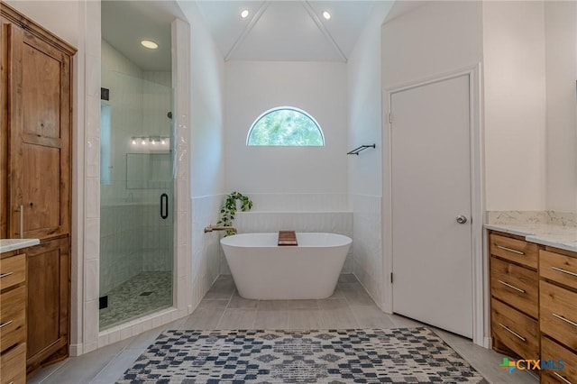806 Northstar Loop, New Braunfels, TX 78130 - full bath with vanity, a stall shower, a freestanding tub, tile patterned floors, and recessed lighting