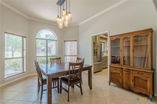 806 Northstar Loop, New Braunfels, TX 78130 - dining space featuring light tile patterned floors, ornamental molding, a chandelier, and baseboards