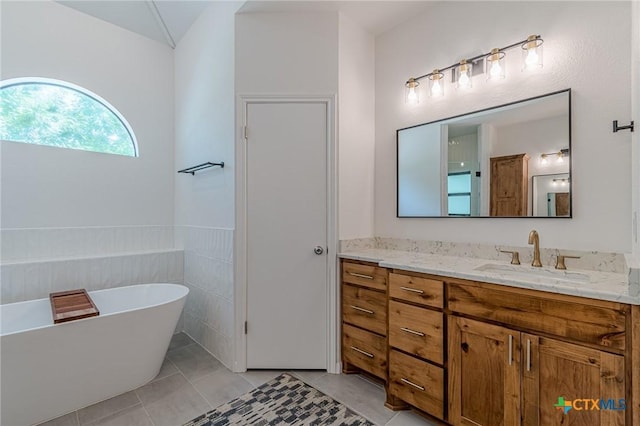 806 Northstar Loop, New Braunfels, TX 78130 - full bath featuring vanity, a soaking tub, and tile patterned floors
