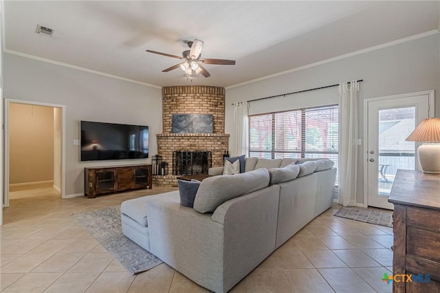 806 Northstar Loop, New Braunfels, TX 78130 - living area with light tile patterned flooring, ceiling fan, ornamental molding, a fireplace, and baseboards