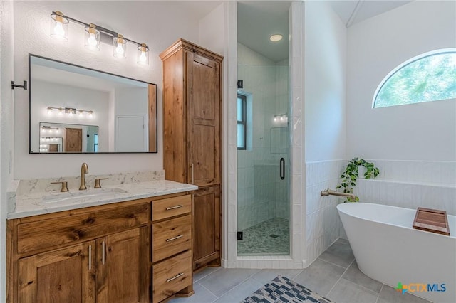 806 Northstar Loop, New Braunfels, TX 78130 - full bath featuring vanity, a shower stall, a freestanding bath, and tile patterned flooring