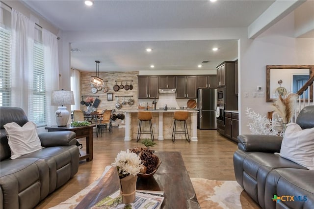 1531 Esser Xing, Canyon Lake, TX 78132 - living area featuring light wood-style flooring and recessed lighting