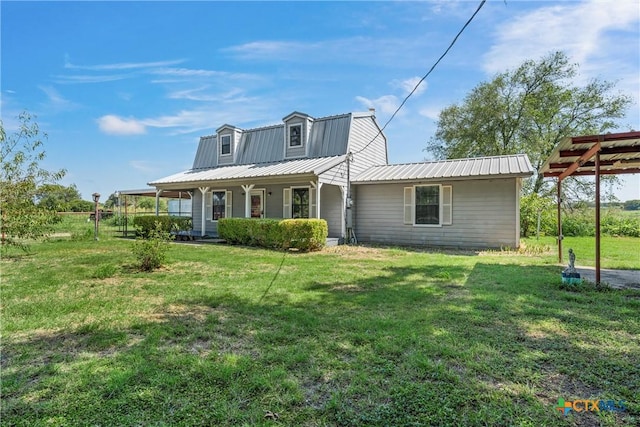 back of property with a porch and a lawn