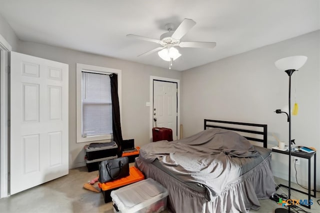 bedroom with ceiling fan and a closet