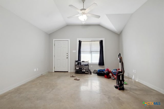 interior space with lofted ceiling and ceiling fan