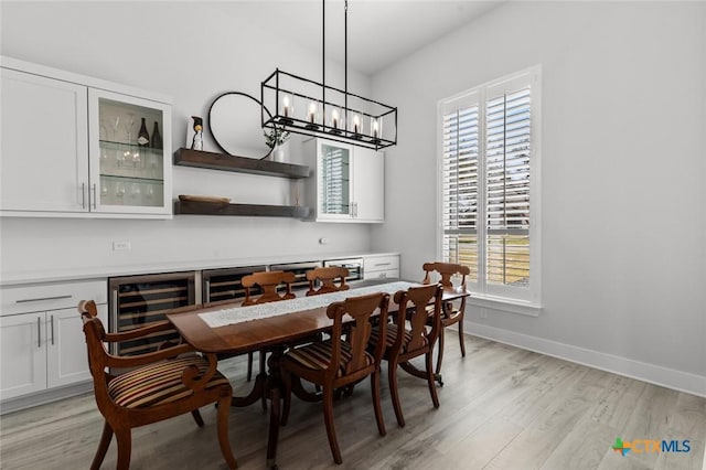 12 Lago Viento Ln, Belton, TX 76513 - dining space featuring baseboards, a chandelier, plenty of natural light, and light wood-style floors