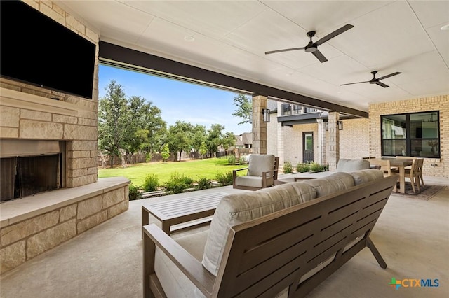12 Lago Viento Ln, Belton, TX 76513 - view of patio / terrace featuring ceiling fan, outdoor dining space, and an outdoor living space with a fireplace