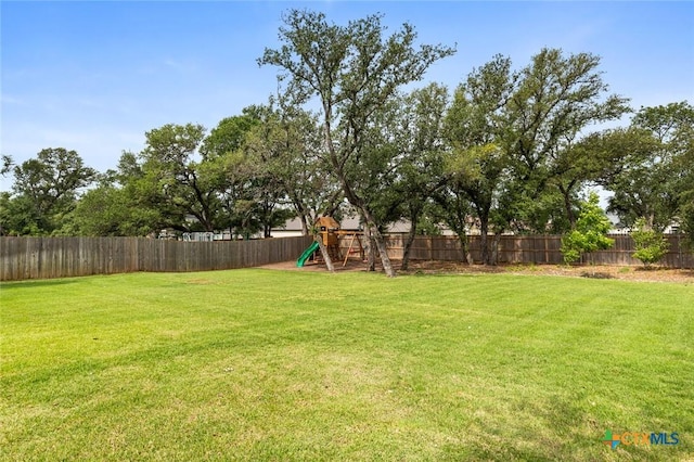 12 Lago Viento Ln, Belton, TX 76513 - view of yard featuring a fenced backyard and a playground