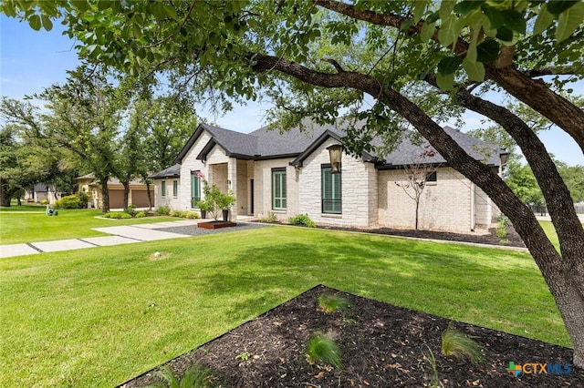 12 Lago Viento Ln, Belton, TX 76513 - view of front of house featuring brick siding, a front lawn, and stone siding
