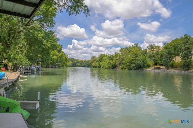 view of water feature with a dock