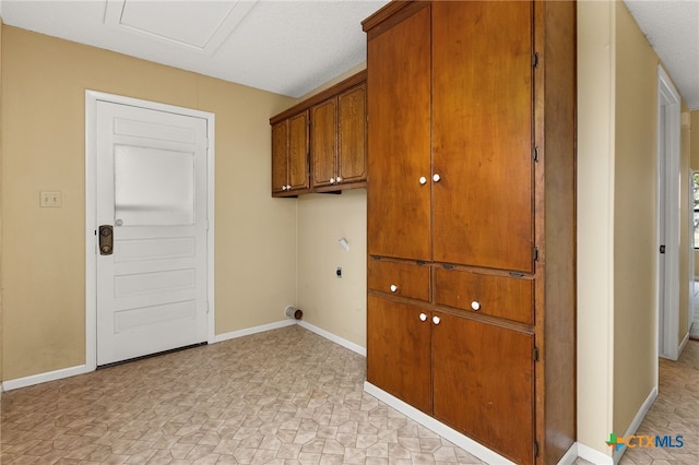 washroom with cabinets and hookup for an electric dryer