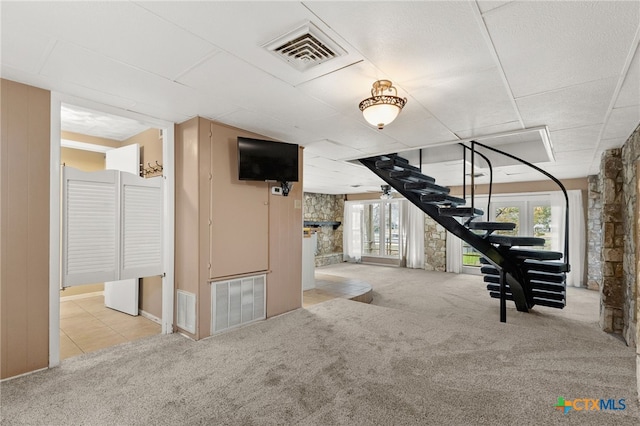 interior space featuring light colored carpet and a wealth of natural light