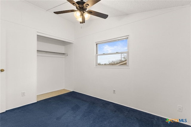 unfurnished bedroom featuring ceiling fan, carpet flooring, and a closet