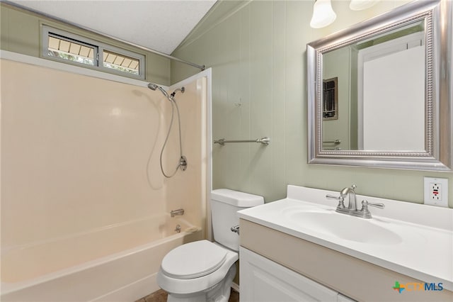 full bathroom featuring shower / washtub combination, lofted ceiling, vanity, and toilet