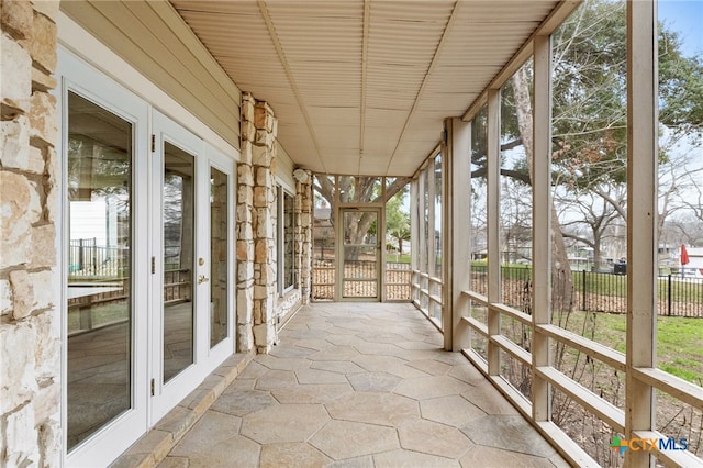 unfurnished sunroom with a wealth of natural light