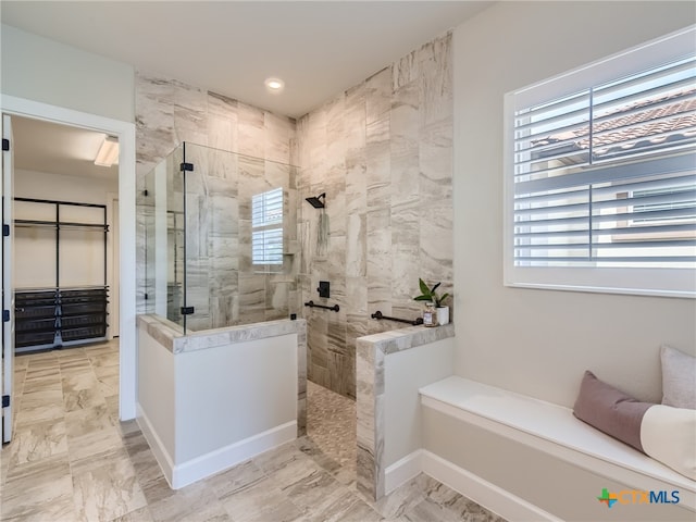 bathroom with a tile shower