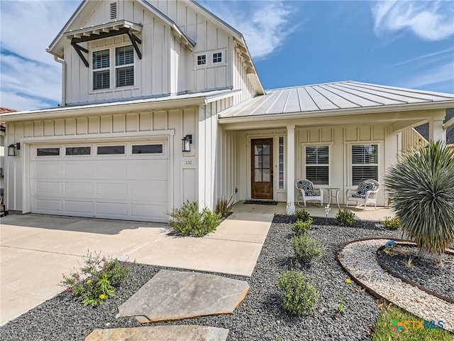 view of front facade featuring a garage and covered porch