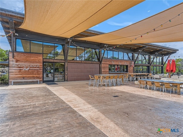 view of patio / terrace featuring an outdoor bar