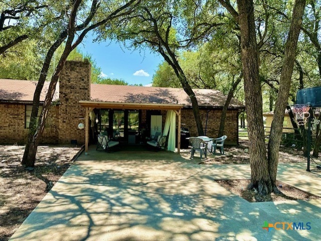 view of side of property with a carport