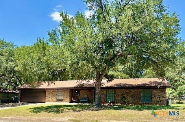 ranch-style home featuring a garage