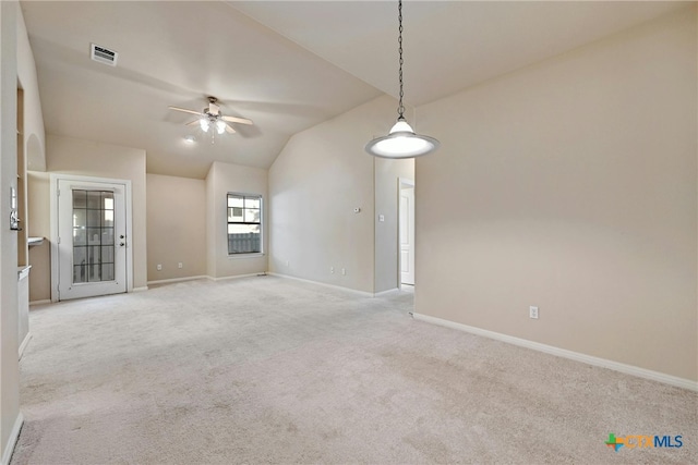 carpeted spare room featuring ceiling fan and lofted ceiling