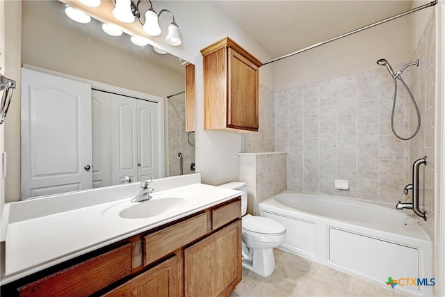 full bathroom with toilet, vanity, and tiled shower / bath