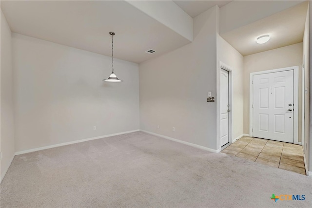 unfurnished room with light colored carpet