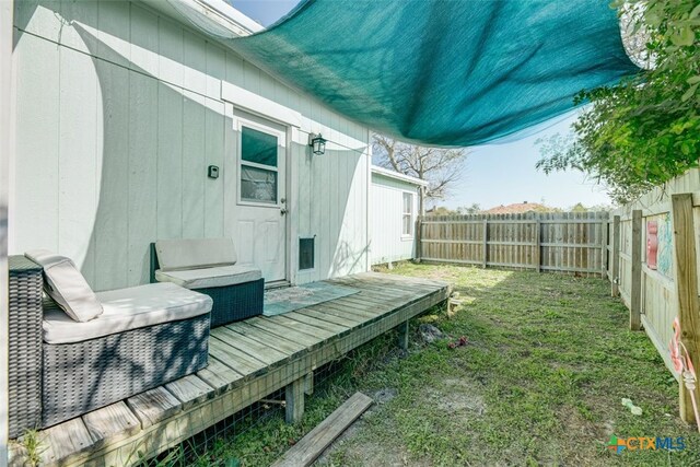 243 E Magnolia Ave, Aransas Pass, TX 78336 - bedroom featuring wood finished floors, lofted ceiling, ceiling fan, and a wall unit AC