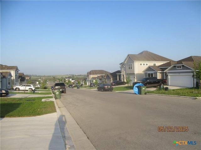 336 Mclintock Rd, Jarrell, TX 76537 - view of asphalt street with curbs and a residential view