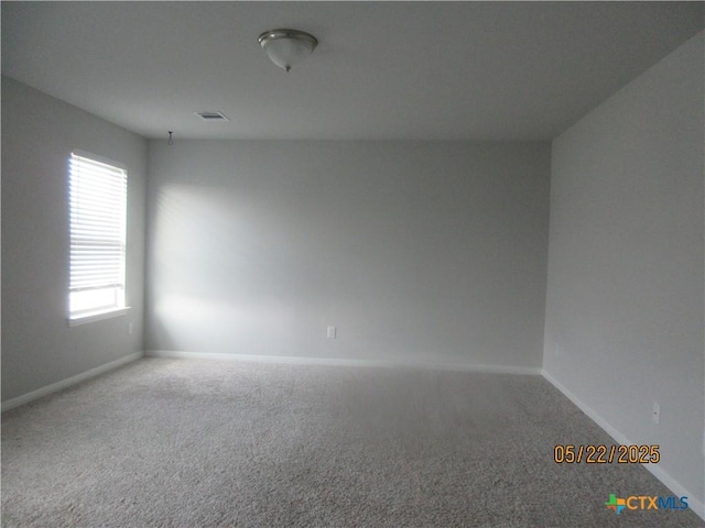 336 Mclintock Rd, Jarrell, TX 76537 - spare room featuring carpet floors and baseboards