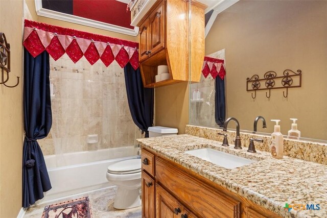 bathroom featuring vanity, bathtub / shower combination, and toilet
