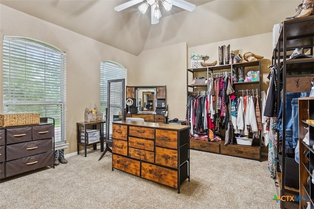 spacious closet featuring a ceiling fan, lofted ceiling, and carpet