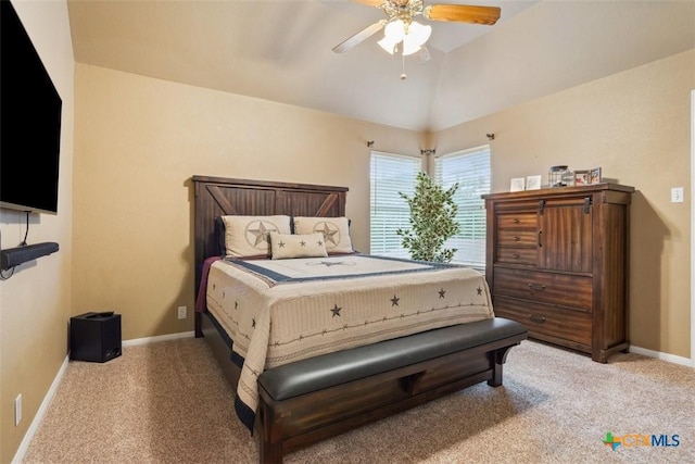 bedroom featuring baseboards, carpet flooring, a ceiling fan, and vaulted ceiling