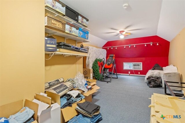 game room featuring carpet floors, ceiling fan, vaulted ceiling, and a wall unit AC