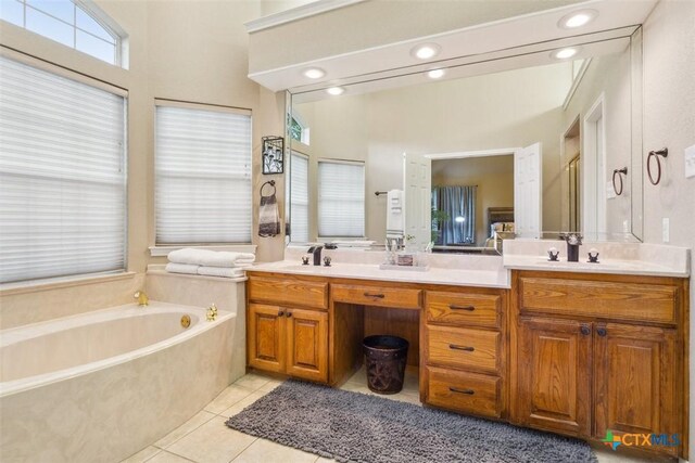 full bath featuring tile patterned flooring, double vanity, a shower with door, a bath, and a sink