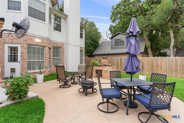view of patio / terrace with outdoor dining area and fence
