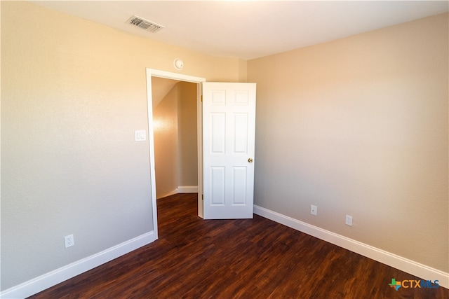 empty room featuring dark hardwood / wood-style floors