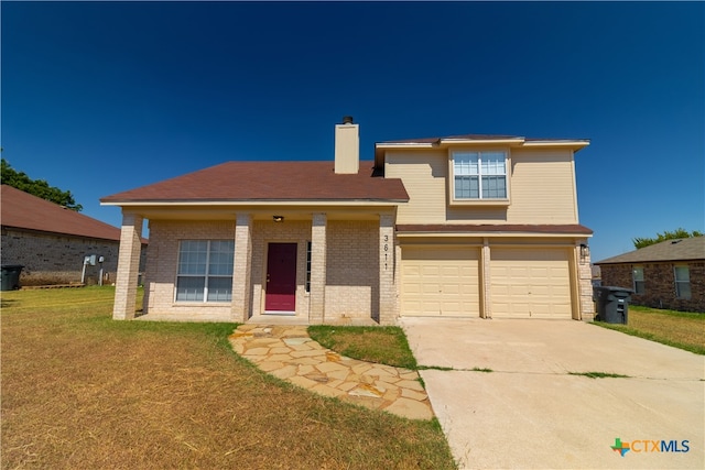 view of front facade featuring a garage and a front yard